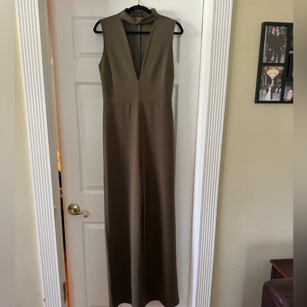 Plunge neck line olive wide leg jumpsuit/romper.